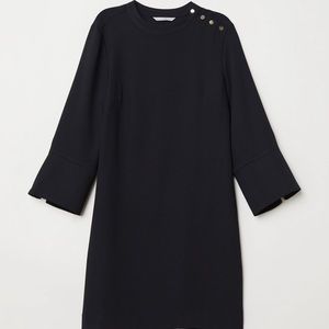 Black shift dress detailed with gold buttons
